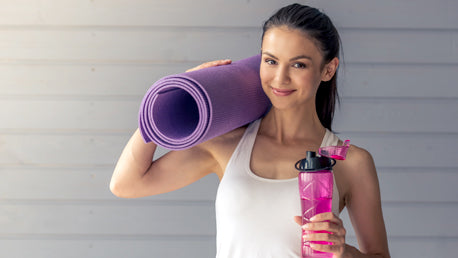 Girl Posing with a Yoga Mat & Water Bottle
