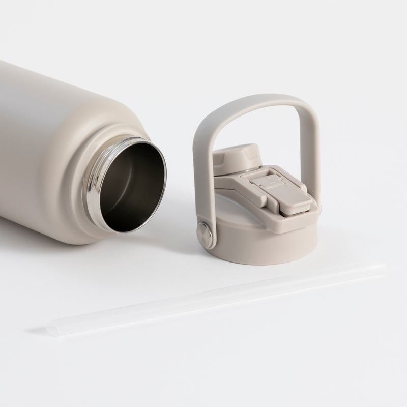 Insulated grey water bottle with straw, keeps drinks cold 24 hours