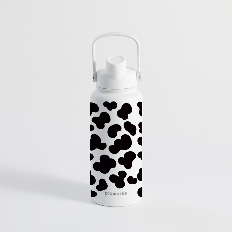 Proworks Switch 1L cow print water bottle with straw in cow print