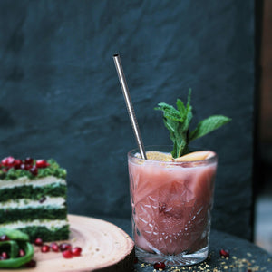 A Proworks Reusable Straw in a Cocktail